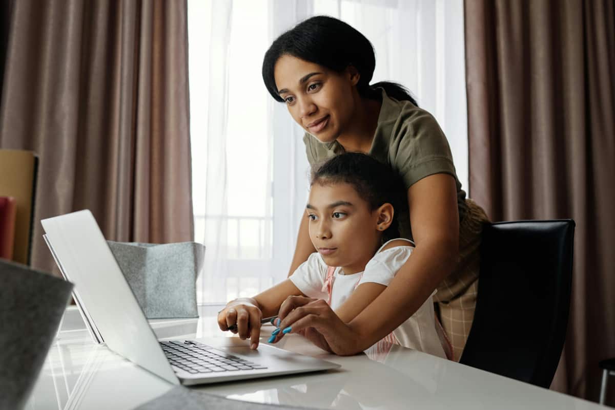 A mother teaching her son at home