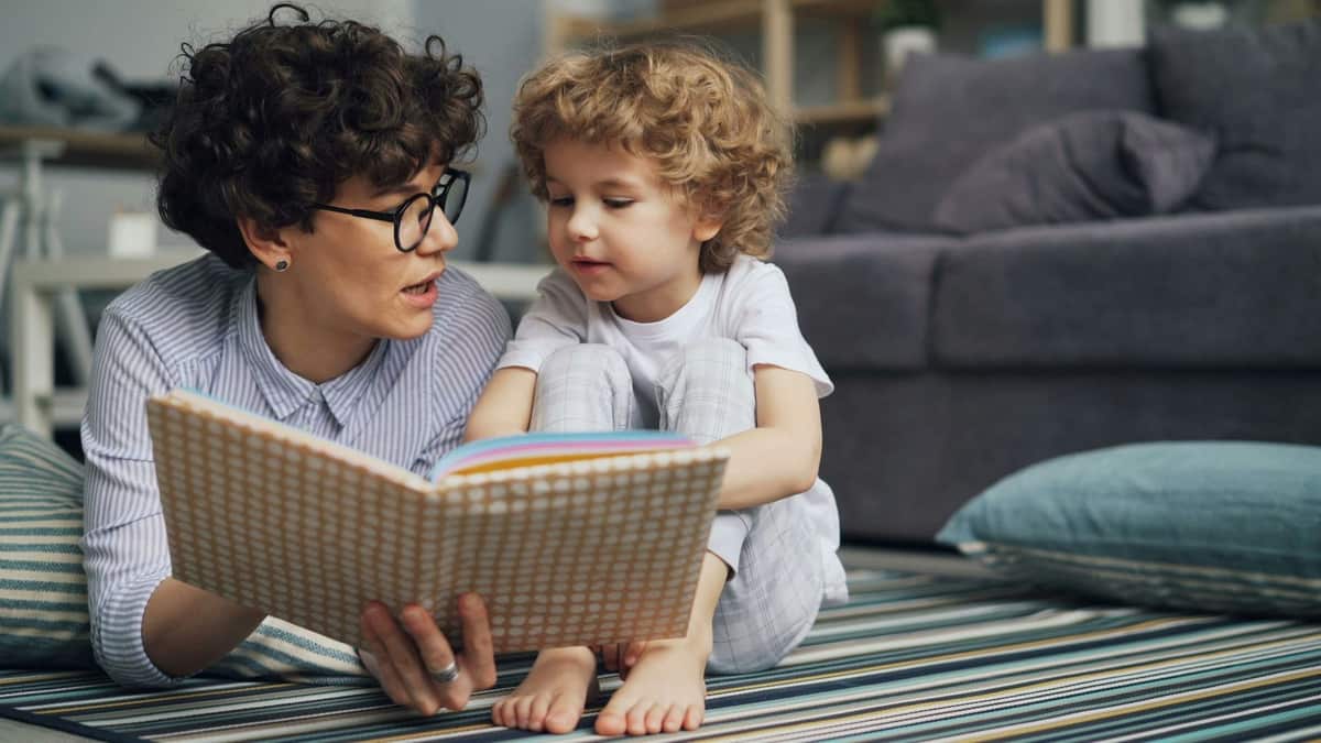 A mother and son reading together
